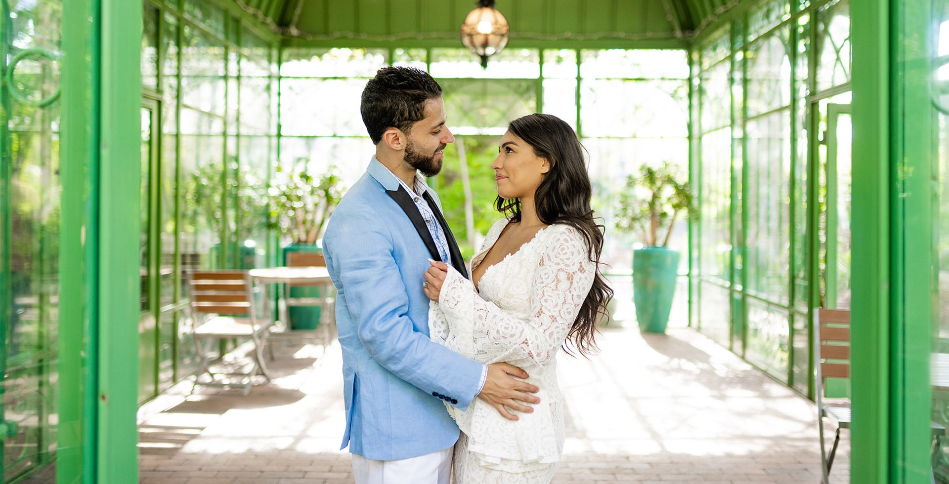 engaged couple posing in the Denver Botanical Gardens